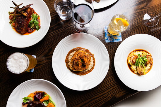 A tempting spread of beautifully plated dishes at Abel Brown Southern Kitchen & Oyster Bar.