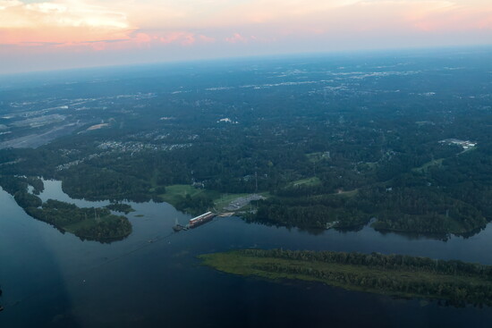 The Augusta Canal Headgates and Savannah River beneath a soft evening sky.