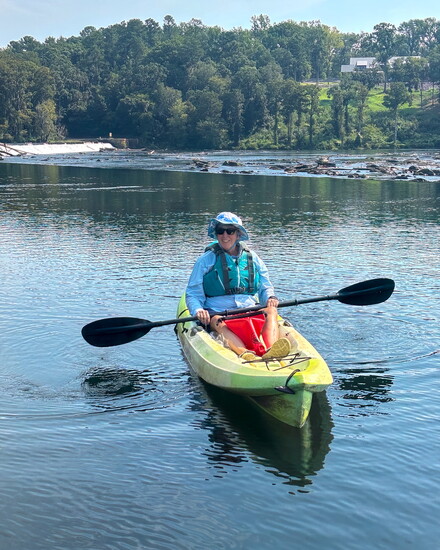 Gayle Bryan pauses just above the dam during the return paddle from Stallings Island.