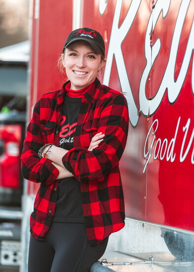 Caitlin McGrath-Levesque in front of Red's Good Vibes food truck
