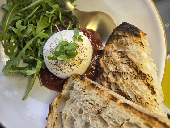 Burrata with strawberry compote, basil, and toasted bread. Photo credit: Jennifer Waldera