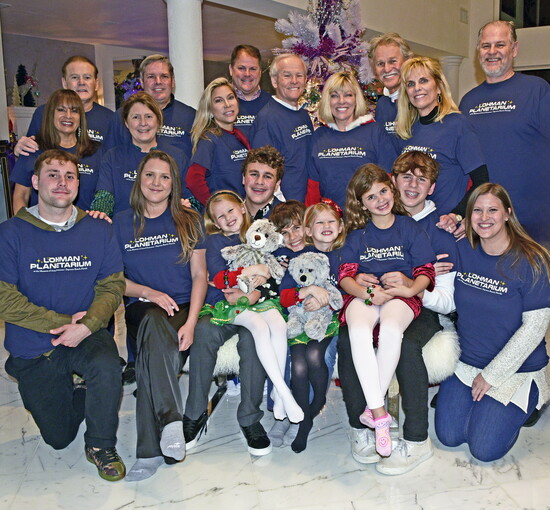 The Lohman Family celebrating Christmas at the Lohman Planetarium.