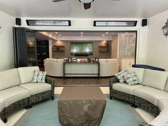 Basement living room opens up to outdoor covered increased living space