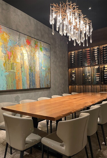 Custom table and lighting and art by The Interior