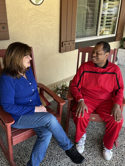 Maureen with a resident. Photo by Ellee Coleman
