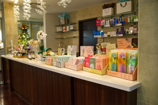 Sole-renity Spa's lobby showcases products like high-end skincare and fragrance lines.
