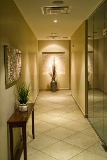Spa hallway and treatment rooms are decorated with calm and soothing colors.