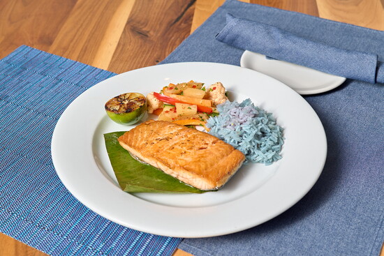 A Citrus-Glazed Salmon with butterfly pea flower rice & Asian pickled vegetables served at Cotton Hollow