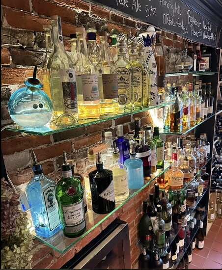 Bottles line the wall of the bar at 2Hopewell. 