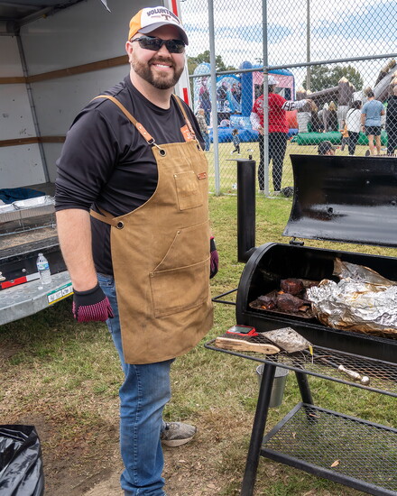 A BBQ pro shows off his handiwork during the Pig Fest.