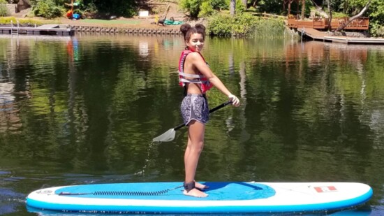 The apple doesn't fall far from the tree - Jeff's daughter Camille also enjoys paddle boarding.