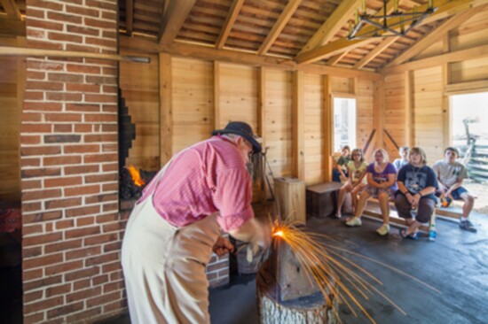 Blacksmithing in the restored  1840's Blacksmith Shop