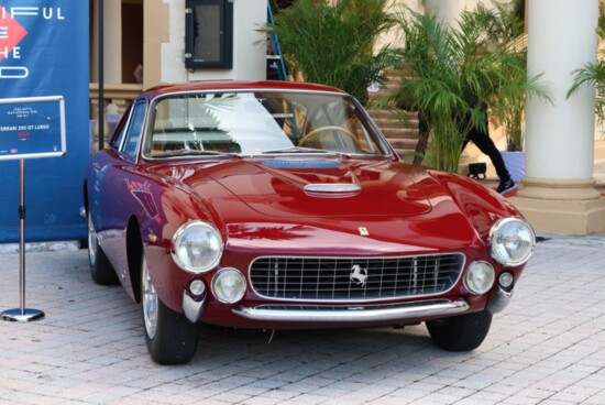 This 1000 Miglia race car is a 1964 Ferrari 250 GT Lusso 1964 on display in Miami.