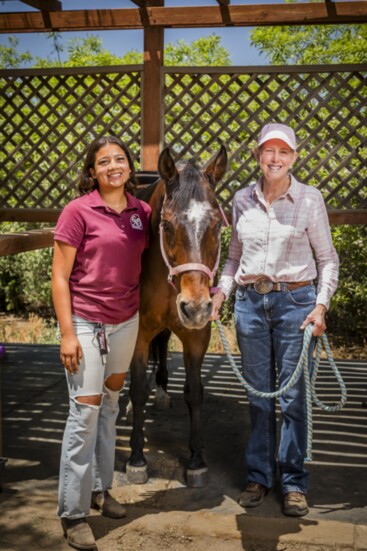 GAIT Program Founder & Director, Margaret Rich (R) with a GAIT staff member and school horse.