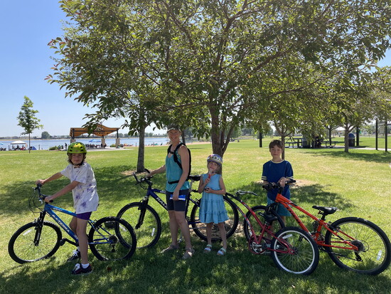 A family rides to Boardwalk Park for a frozen treat on Bike Everywhere Day.