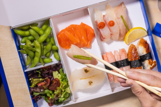 A combination box featuring an assortment of sushi