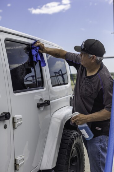 Customers enjoy complementary window cleaning supplies.