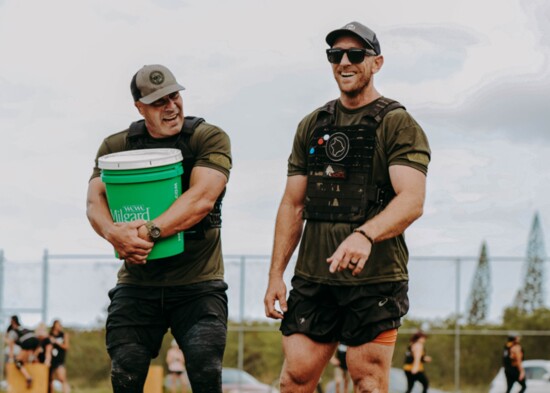 Lieutenant Jeremy Scott Lewis on the left, training with Tiger Hill on the right.