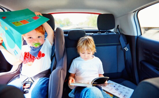 Reading can help kids pass the travel time.