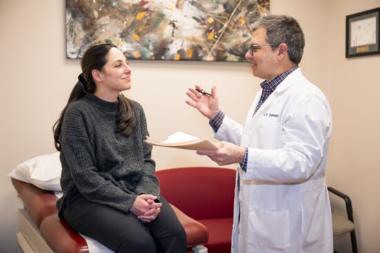 Dr. Chengelis counsels a patient