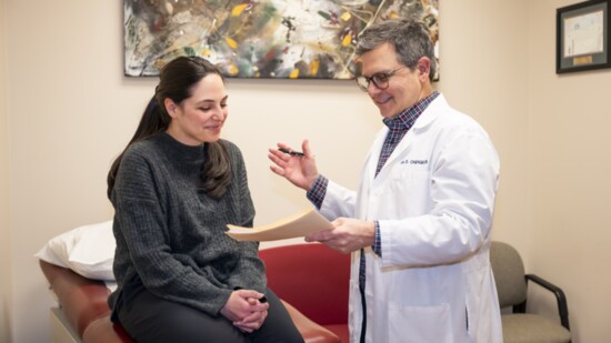 Dr. Chengelis counsels a patient