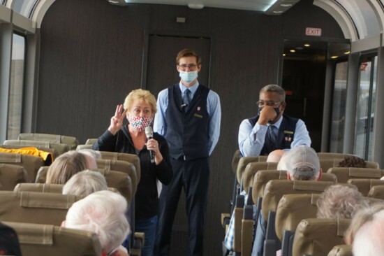 Bonnie Hedges shares memories of the locale with fellow passengers on the Rockies to the Red Rocks Classic tour.