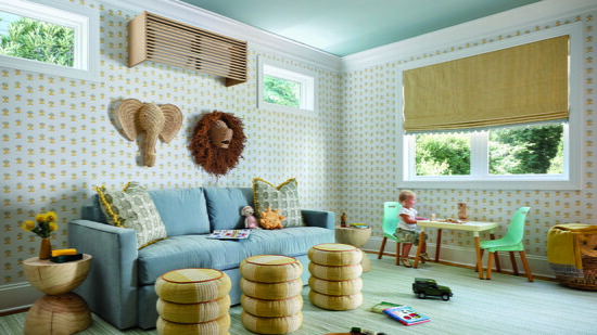 Samuel and Sons cording adds pops of color—blue on the window treatment and orange on three Taylor King ottomans. 