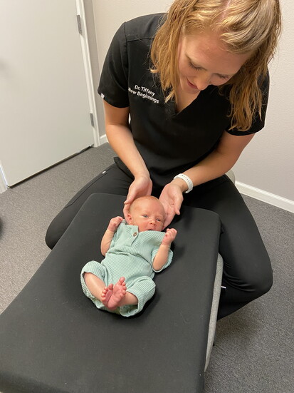 Dr. Tiffany in 2017 provides gentle, specialized care to a newborn, reflecting the focus on supporting families from the very beginning. Photo: Jessica Wendling