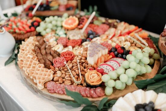 Rosemary & Brie designs artisanal cheeses, premium cured meats, and fresh seasonal accents.