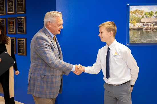 Mayor Wilson congratulates a student