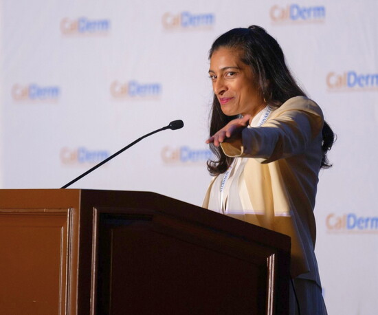 Dr. Manju Dawkins delivers her keynote speech at the CalDerm Symposium.