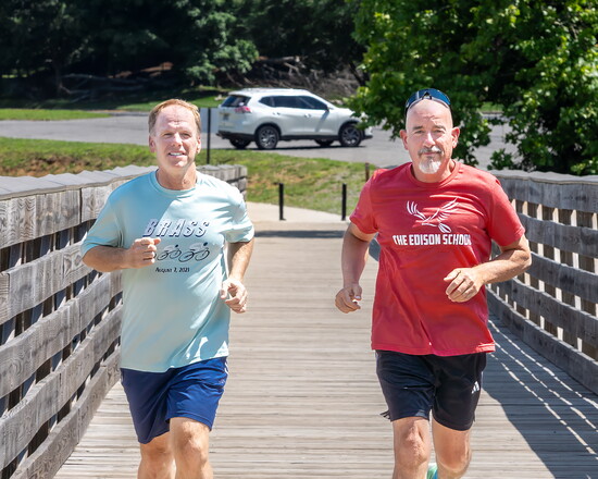 Hendersonville Mayor Jamie Clary and Edison School Headmaster Dr. Jon Wilson enjoy a few miles along the Sanders Ferry Greenway.