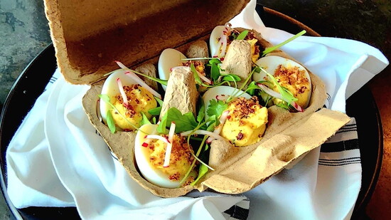 Presented in a farmhouse-style egg holder, these bites feel charming and elevated.