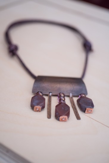 Leather necklace. Copper piece mounted on braided leather. Purple beading, copper and agate trinkets | $99 
