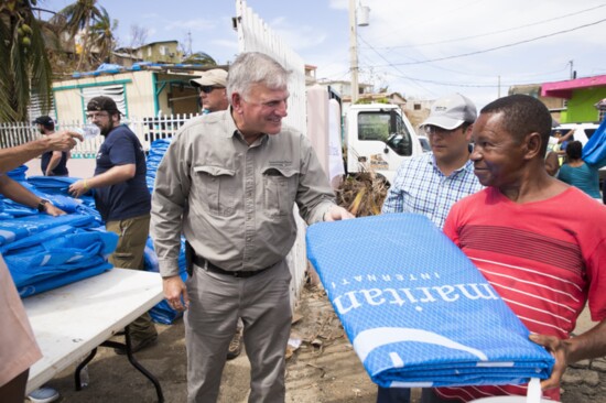 Franklin Graham distributing solar lights and tarp for emergency shelter to families devastated by Hurricane Maria.