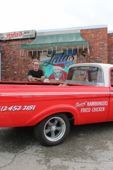 Restaurateur Kelly Chappell with the vintage Top Notch truck outside of Lala's Little Nugget. Image by Julie Royce.