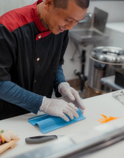 Chef Leo preparing one of the sushi rolls