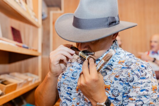 Dean Cavero, Realtor, enjoying his cigar selection. 