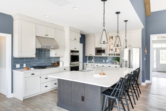Modern kitchen cabinetry and islands are combined with advanced appliances in the kitchens.