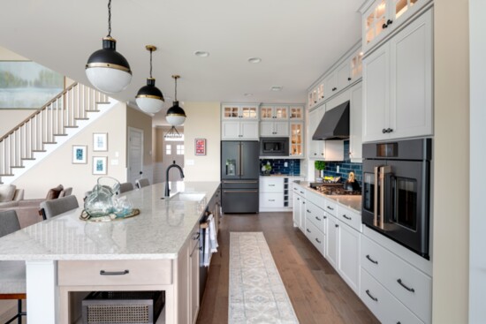 Modern kitchen cabinetry and islands are combined with advanced appliances in the kitchens.