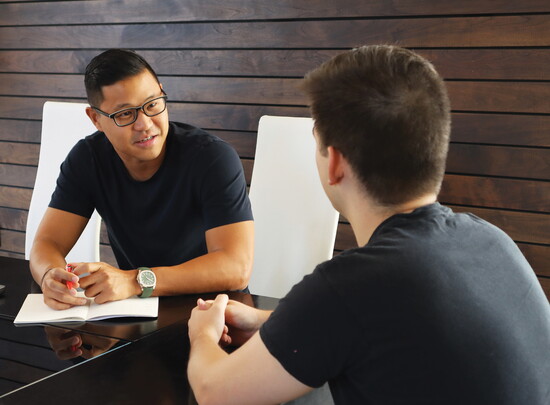 Command Education founder and CEO Christopher Rim working with a student