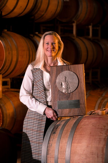 Emily Hodson holding her Rich Smith Award. Photo Credit: Jeremy Chapline/@thecharredcask