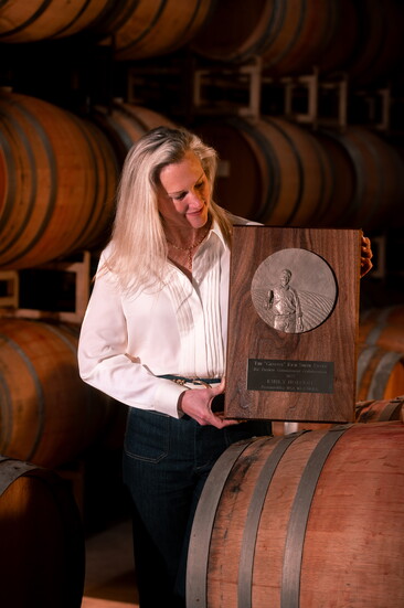 Emily Hodson holding her Rich Smith Award. Photo Credit: Jeremy Chapline/@thecharredcask