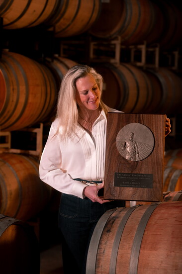 Emily Hodson holding her Rich Smith Award. Photo Credit: Jeremy Chapline/@thecharredcask
