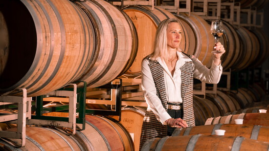 Emily Hodson examining wine. Photo Credit: Jeremy Chapline/@thecharredcask