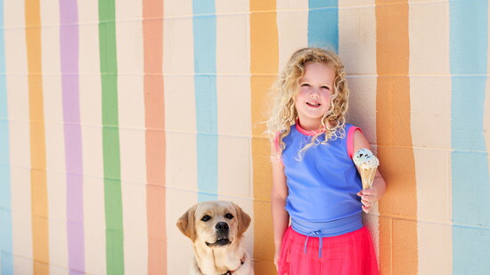 Photo by Olly Yung. Mural is Confetti Stripes Wall by Evelyn Henson.