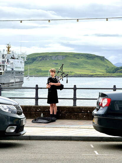 A lone piper plays for passers by on the waterfront in Oban. 