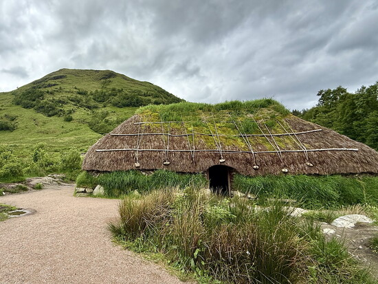 At Glencoe Visitor Centre, a reconstructed 17th century turf and creel house sits at the foot of Meall Mòr.