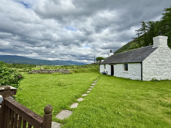 A traditional cottage near the foot of Ben Nevis mountain, outside of Fort William.
