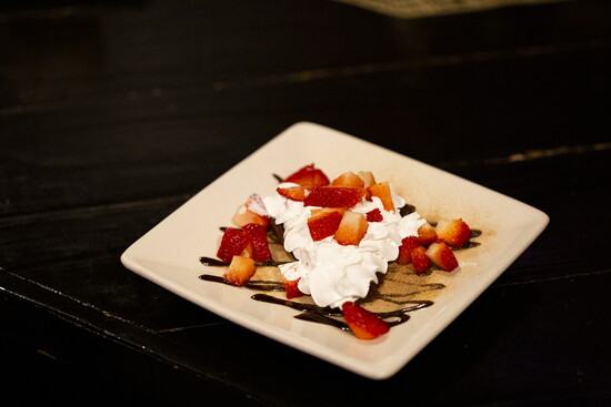 Scratch's Tres Leches are served with a house-made crème fraîche and fresh strawberries.